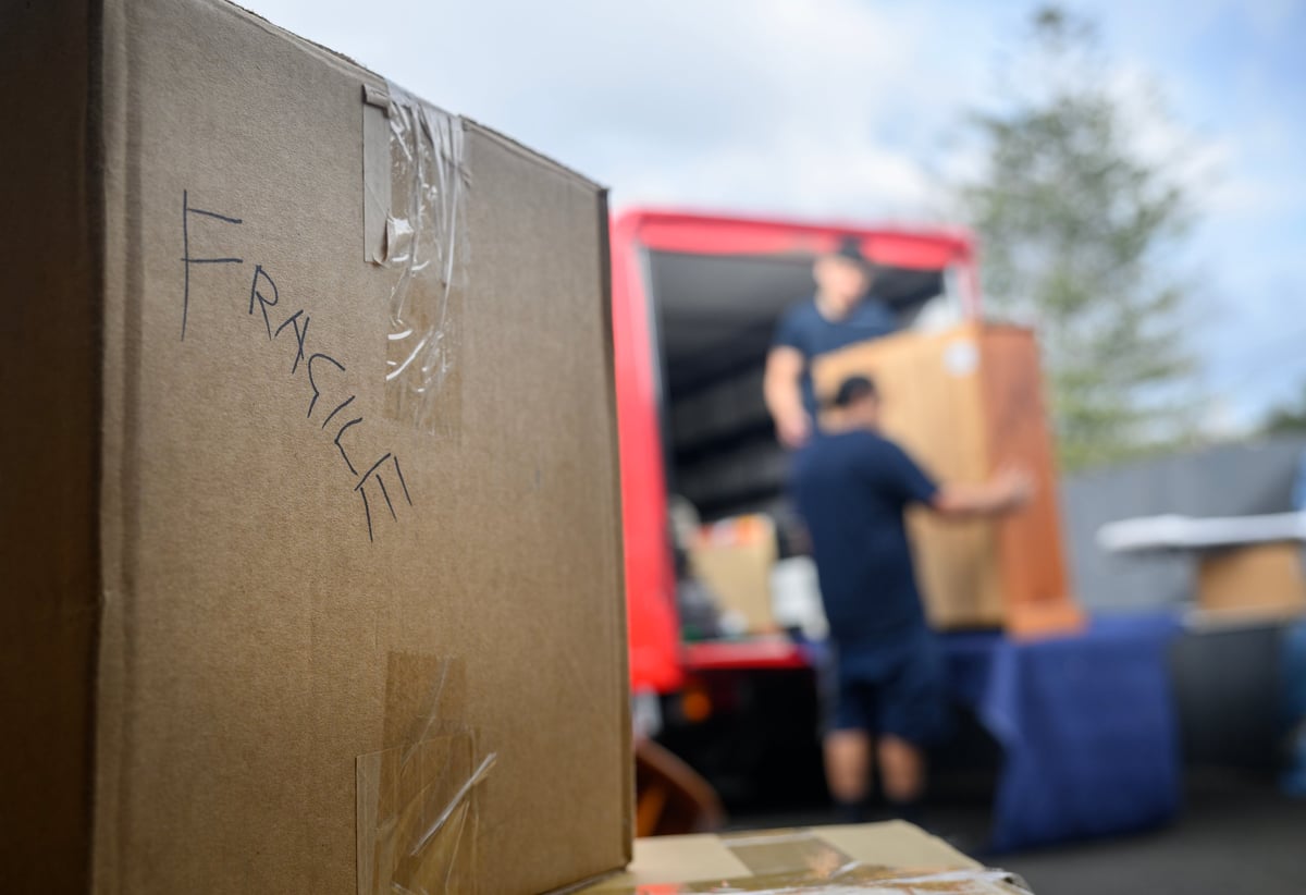 Boxes labelled fragile being carefully loaded during an Orléans estate cleanout by JunkPal in Ottawa.